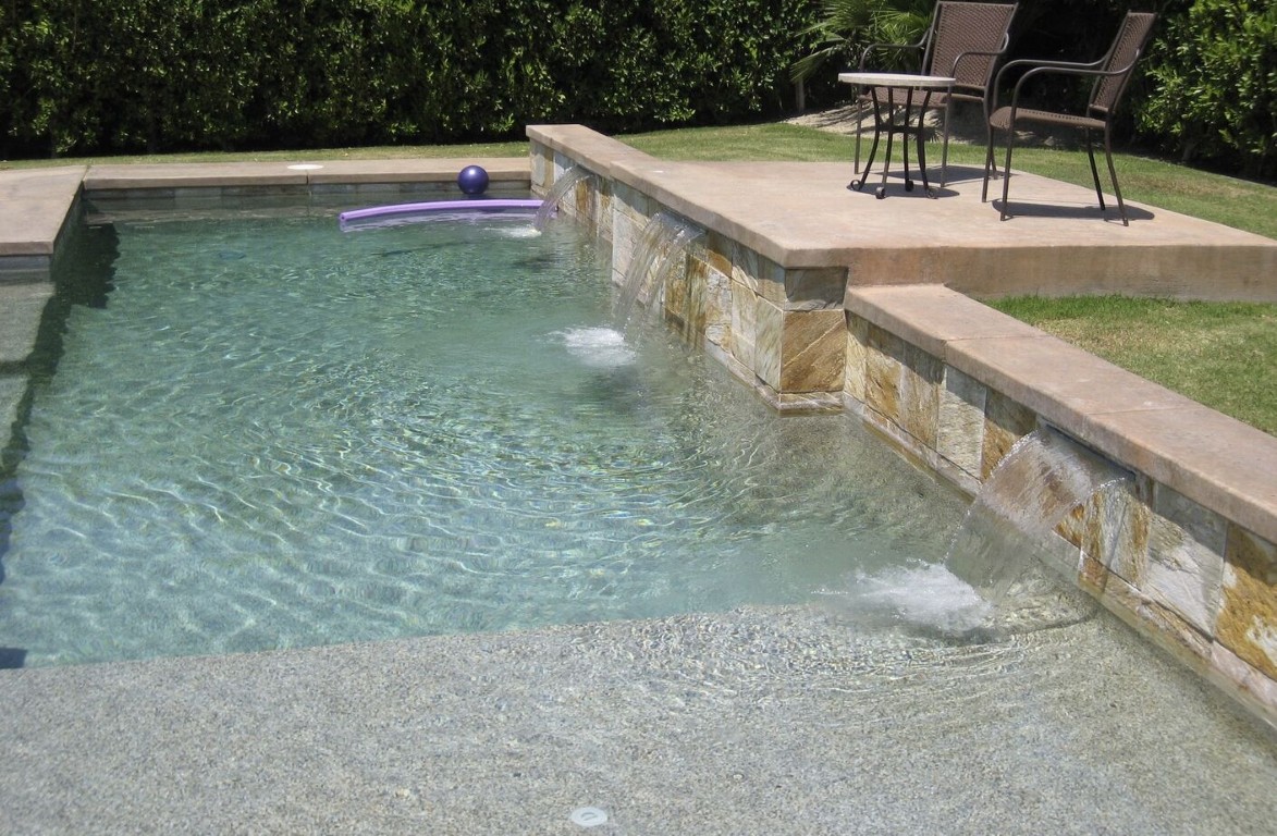 Pool with clean water and stone feature in Vista, CA