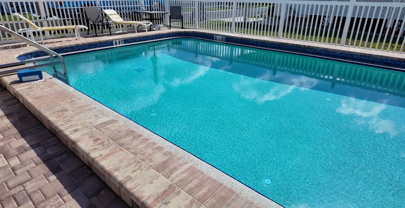 Crystal clear residential pool with brick pavers in Vista, CA
